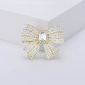 Crystal Bow Brooch with Center Stone in Three Metal Finishes view 4
