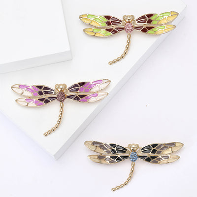 Enamel Dragonfly Brooch with Chain Tail shown against a white display background