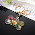 Transparent Resin Pressed Flower Dog Bone Clip Keychains in Three Colors view 3