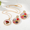 Gold Tone Pressed Flower Resin Necklace and Earring Options view 2