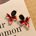 Black Oval and Red White Orchid Flower Stud Earrings view 6