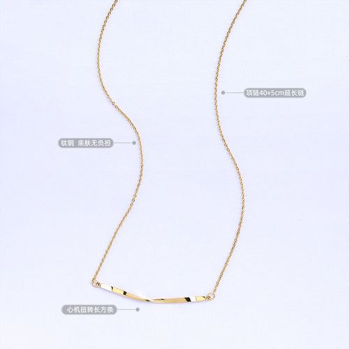 Gold smile bar necklace flat lay with length and material labels