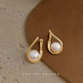 Gold Tone Open Teardrop Frame And White Pearl Stud Earrings view 4