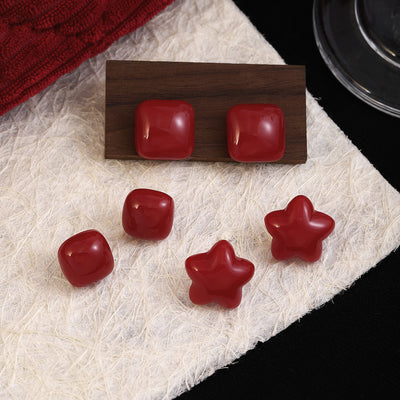Primary supplied view of red star and square stud earrings