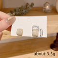 Gold Cream Swirl Square Stud Earrings Soft Gloss Finish view 4