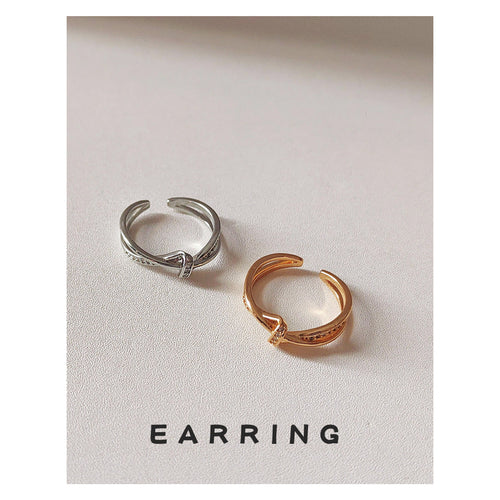 Crossed polished open rings showing both finishes.