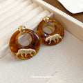 Amber Brown Resin Hoop Earrings With White Tiger Motif view 3