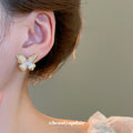 Gold Tone Butterfly Stud Earrings with Pink Crystal Centers view 3