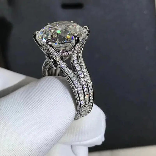 Silver Tone Six Prong Round Stone Split Shank Ring shown in styled view
