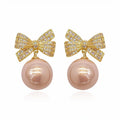 Gold Tone Bow and Pearl Drop Stud Earrings in Two Colors view 5