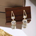 Gold Tone Open Teardrop Clear Look Caged Ball Earrings view 2
