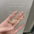 Gold Tone Twisted Lattice Mesh Hoop Earrings Hinged Pair view 1