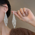 Layered Crystal Chandelier Earrings With Polished Metal Tone Details view 2