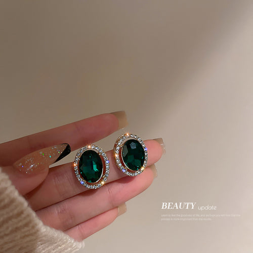 Green Oval Crystal Halo Stud Statement earrings Pair in a styled product view