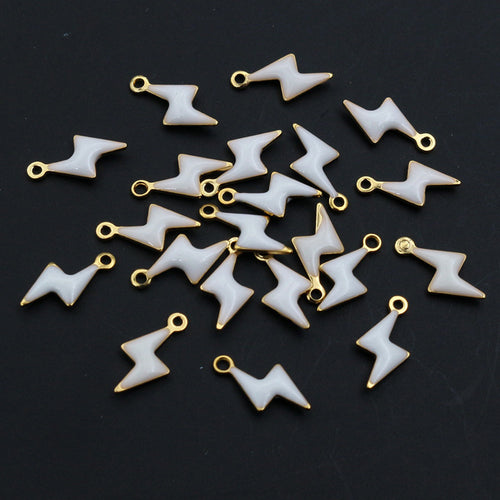 Lightning bolt charms arranged to show surface details