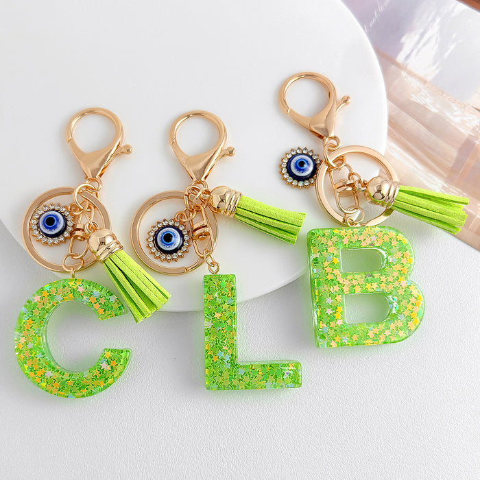 Green Glitter Letter Keychain with Evil Eye Charm and Suede Tassel