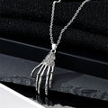 Silver Tone Skeleton Hand Pendant Necklace and Huggie Earrings view 2