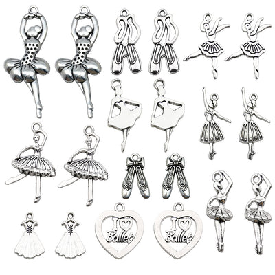 Antique silver flower charms arranged on a light background