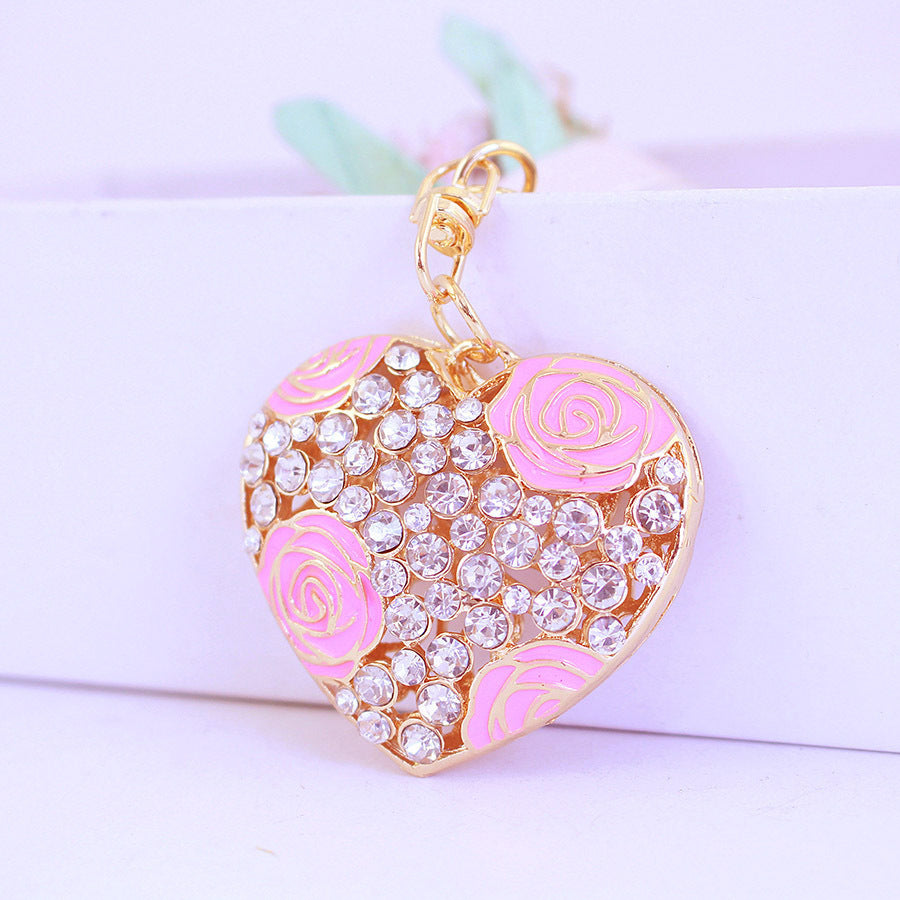 Rhinestone Perfume Bottle Keychain with Four Leaf Clover Metal Bag Charm