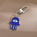 Gold and Silver Tone Crystal Hamsa Evil Eye Clip Keychains in Six Styles view 7