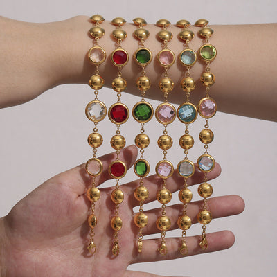 Six gold Czech glass station bracelets in mixed colors on arm