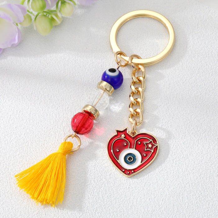 Gold Tone Red Evil Eye Heart Bead and Tassel Keychains