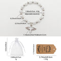 White Cross Bead Stretch Bracelet Winged Cross Charm view 3