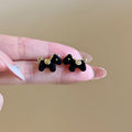 Small Flocked Horse Stud Earrings In Black And Burgundy view 6
