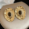 Textured Gold Tone Oval Stud Earrings With Brown Centers view 6