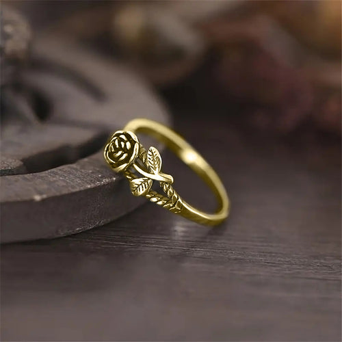 Second product view showing small sculpted rose and leaf ring