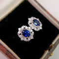 Deep Blue Oval Floral Halo Stud Earrings In Silver Tone view 2