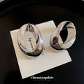 Silver Tone Sculpted Oval Statement Stud Earrings With Polished Metal Details view 2