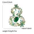 Openwork Gourd Brooch In Metal With Colored Crystals, An Oval Center Stone, And A Bow Top view 6