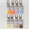 Flocked White Cat Clip Keychains in Nine Outfit Colors view 2