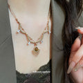 Gold Tone Sunburst and Brown Teardrop Layered Necklace view 1