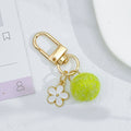 Wool Felt Ball Keychain With White Enamel Flower Charm And Gold-Tone Clasp view 8