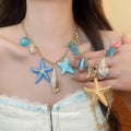 Gold Tone Sea Life Charm Necklace in Two Colorways view 1
