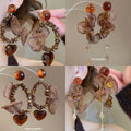 Brown Mesh Pom Pom and Petal Drop Stud Earrings Jewelry Pair view 1