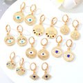 Gold Tone Ornate Evil Eye Medallion Huggie Earrings in Eight Designs view 1