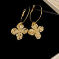 Crinkled Metal Flower Charm Hoop Earrings in Gold and Silver view 6