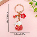 Cat Charm Keychains Featuring Red Blossom Across 17 Pictured Variations view 11