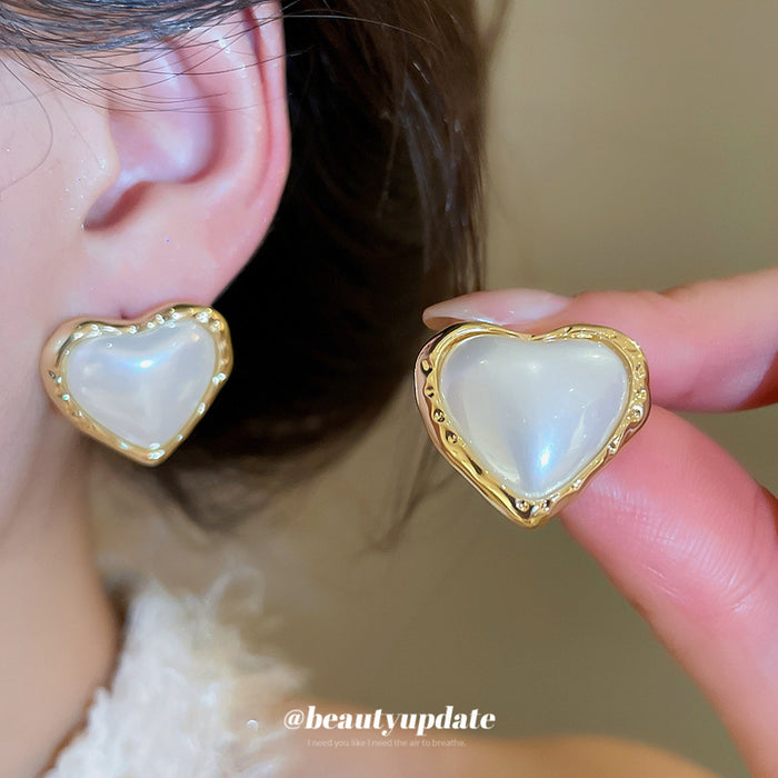 Pearl-Like Heart Stud Earrings with Gold Trim with Polished Metal Details