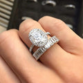 Oval Halo Stone and Tapered Baguette Band Ring Set view 1