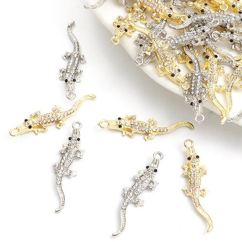 Front assortment of slender alligator silhouettes with clear crystal backs