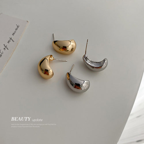 Three Style Gold and Silver Bean Shape Statement earrings in a styled product view