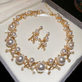 Gold Pearl Cross Link Necklace Matching Drop Earrings view 1
