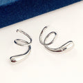 Silver Tone Sculptural Swirl Cuff Earrings with Polished Finish view 1