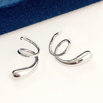 Silver Tone Sculptural Swirl Cuff Earrings with Polished Finish