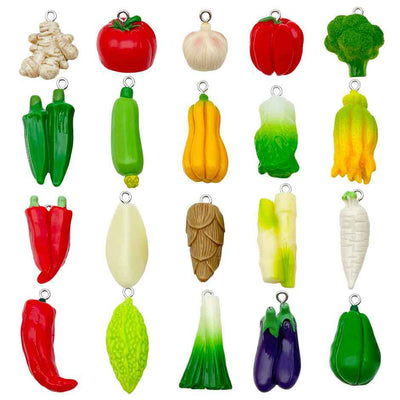 Multicolor chili pepper charms arranged on a light background