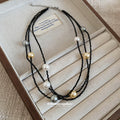 Layered Black Cord Necklace with Gold and Pearl Beads view 2